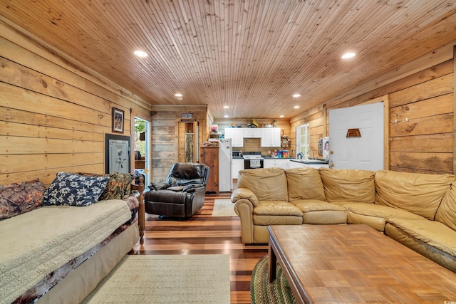 living room with light wood-style floors, recessed lighting, wooden ceiling, and wood walls