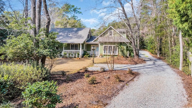 view of front of house with driveway and a porch