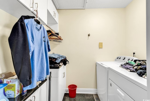 washroom with attic access, washer and dryer, cabinet space, and baseboards