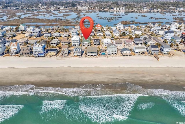 aerial view with a water view, a residential view, and a beach view