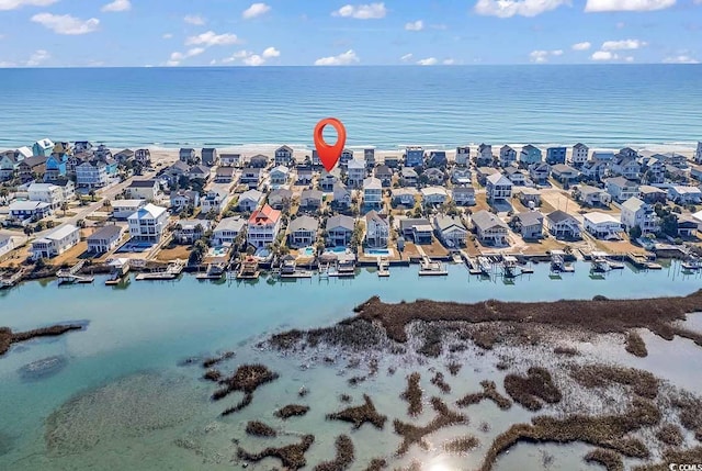 birds eye view of property with a water view and a residential view