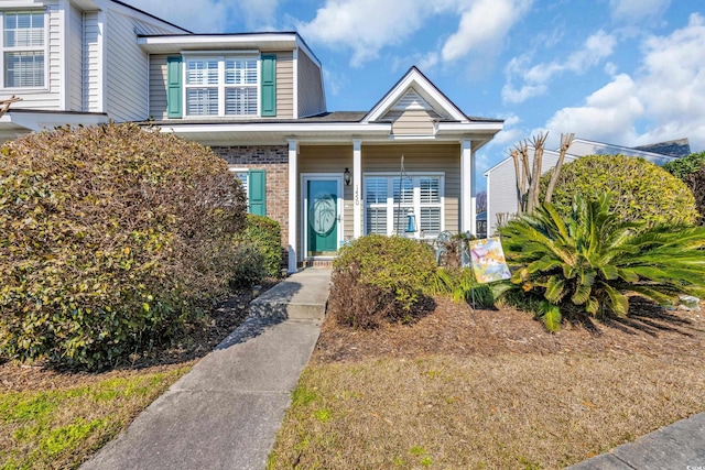 view of front of home with brick siding