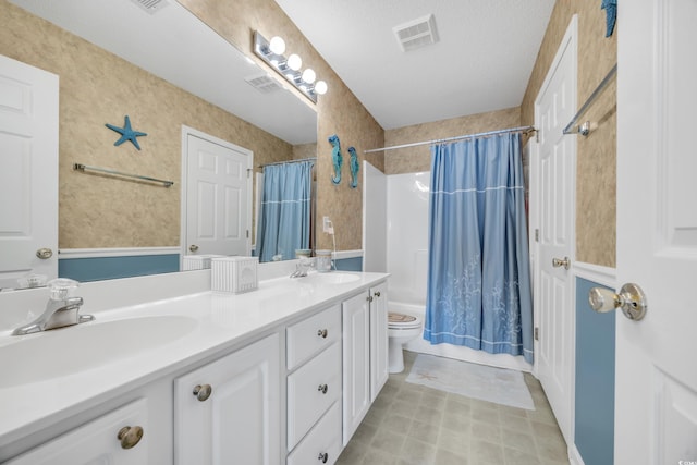 bathroom featuring shower / bath combo, visible vents, a sink, and toilet