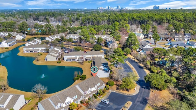 drone / aerial view featuring a residential view and a water view