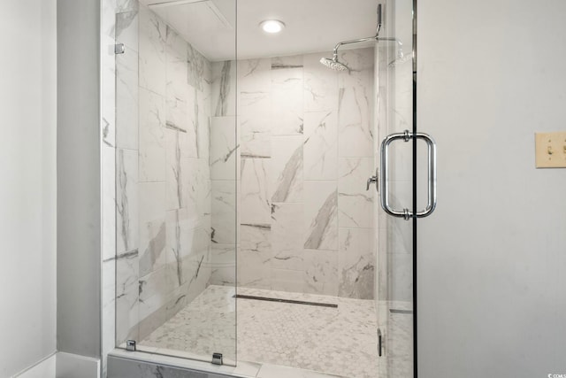 full bathroom with a marble finish shower