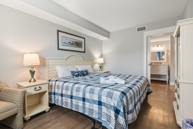 bedroom featuring dark wood-style flooring and visible vents