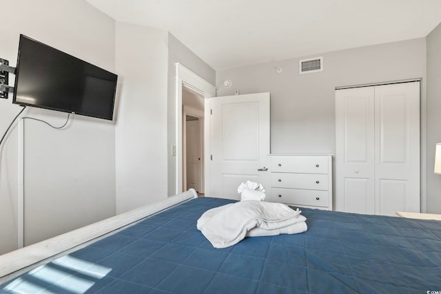 bedroom featuring a closet and visible vents