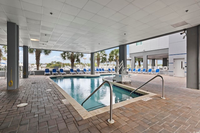 community pool with a patio area