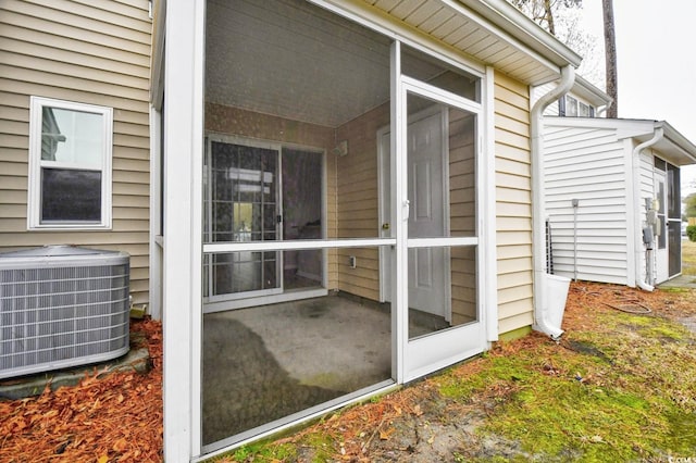 exterior space featuring a sunroom and central AC