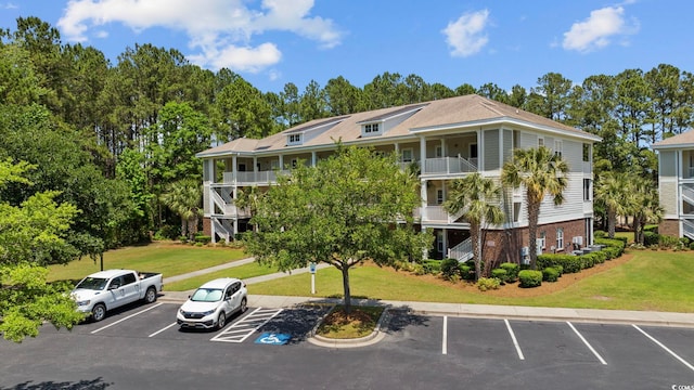 view of property with uncovered parking