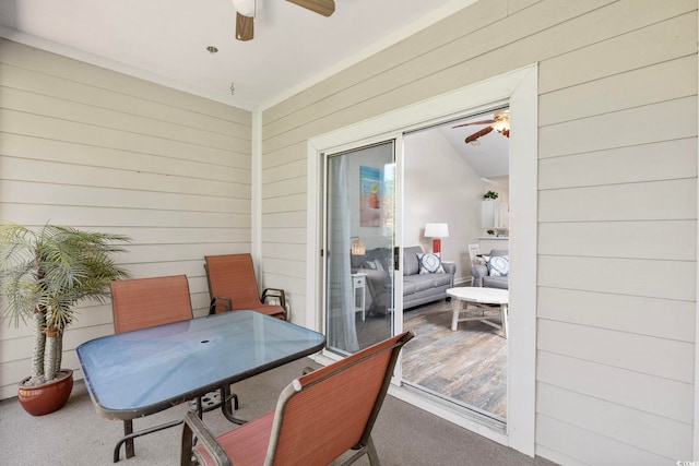 view of patio with outdoor dining area and ceiling fan