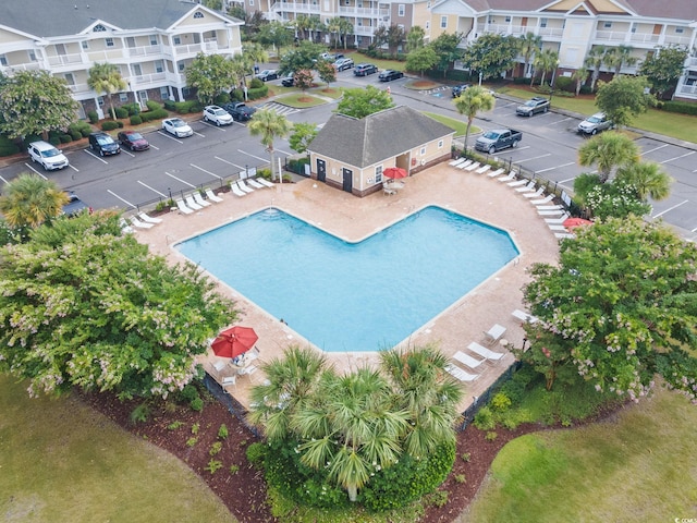 community pool featuring a patio area and a residential view