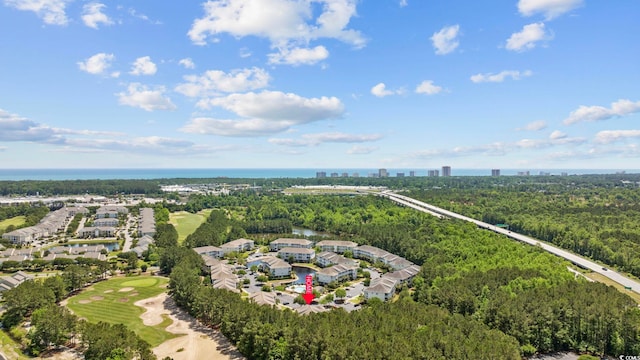 aerial view with a water view and a forest view