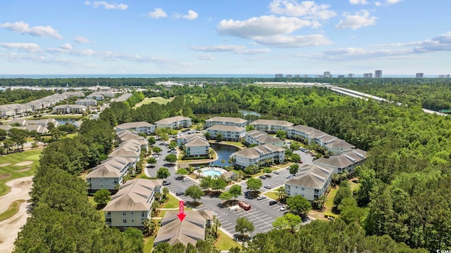 aerial view with a residential view and a wooded view