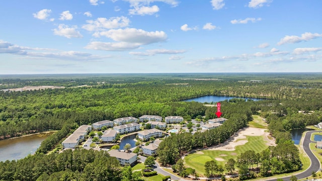 aerial view featuring a water view and a forest view