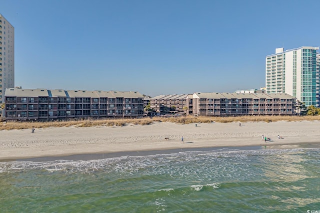 view of water feature featuring a city view and a view of the beach