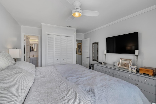 bedroom with ensuite bathroom, a closet, visible vents, and crown molding