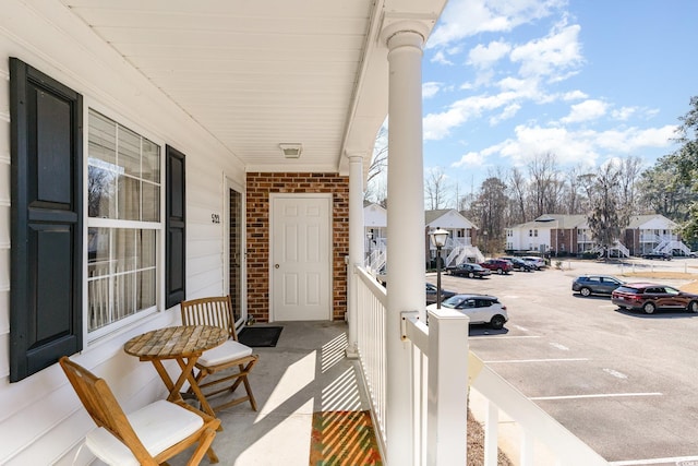 exterior space featuring covered porch and a residential view