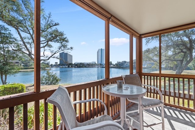 sunroom / solarium with a water view