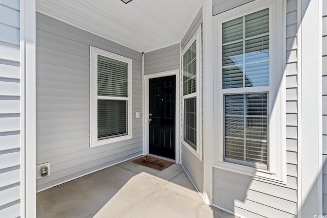 doorway to property with a porch