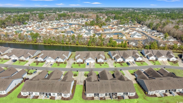 aerial view featuring a residential view and a water view