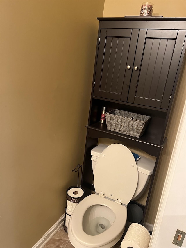 bathroom featuring baseboards and tile patterned floors