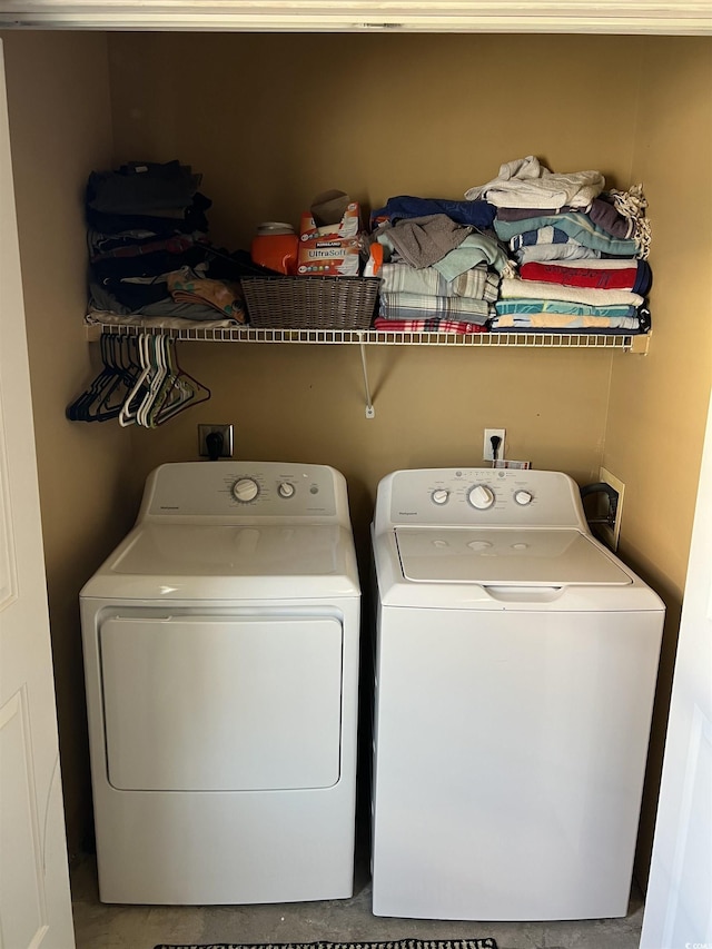 laundry room featuring laundry area and washing machine and clothes dryer