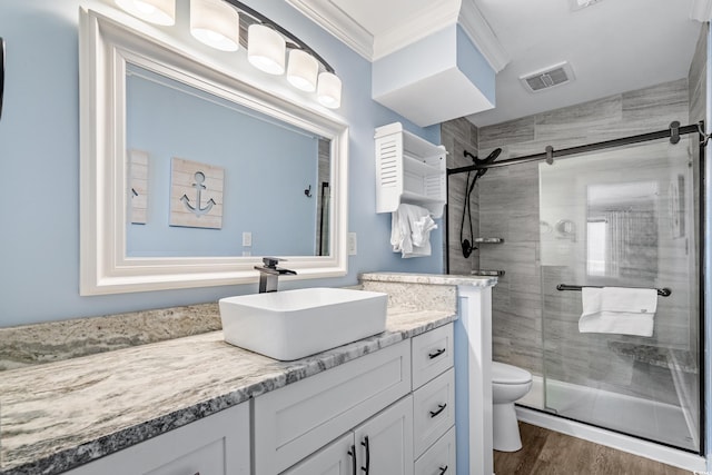 full bath featuring ornamental molding, a stall shower, visible vents, and toilet