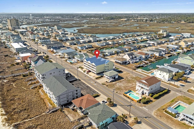 birds eye view of property with a water view and a residential view