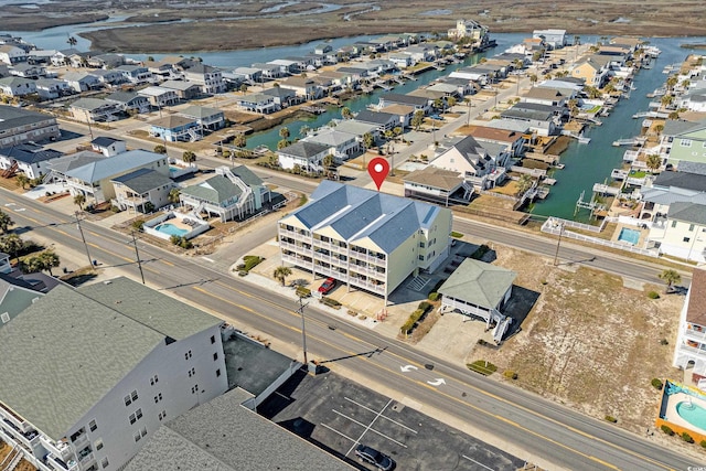 bird's eye view featuring a water view and a residential view