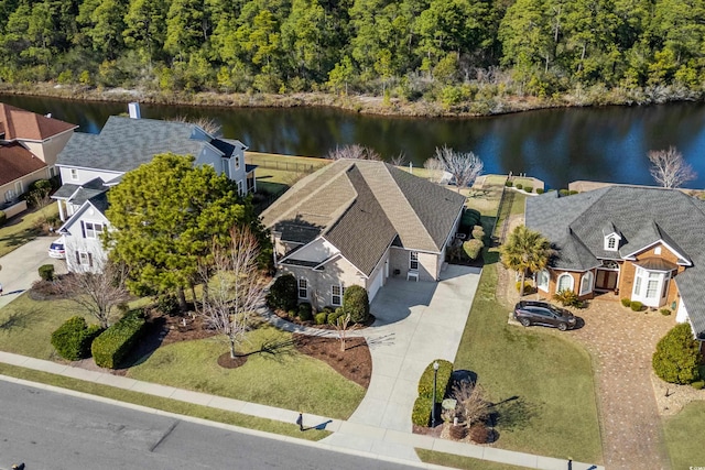 birds eye view of property with a water view