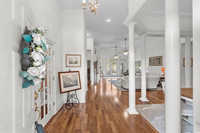 entrance foyer featuring french doors, wood finished floors, a ceiling fan, and ornate columns