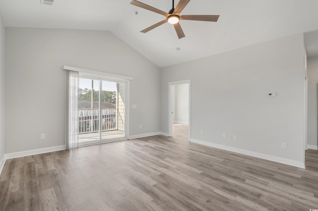 spare room featuring wood finished floors, a ceiling fan, and baseboards