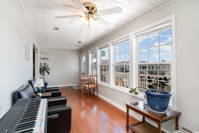 sunroom with visible vents and a wealth of natural light