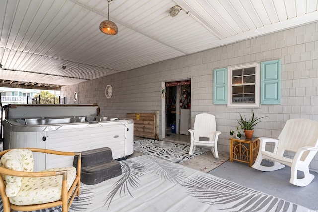 view of patio with a hot tub