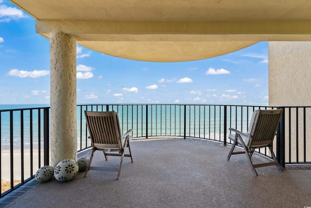 balcony featuring a water view