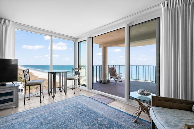 sunroom / solarium with a water view