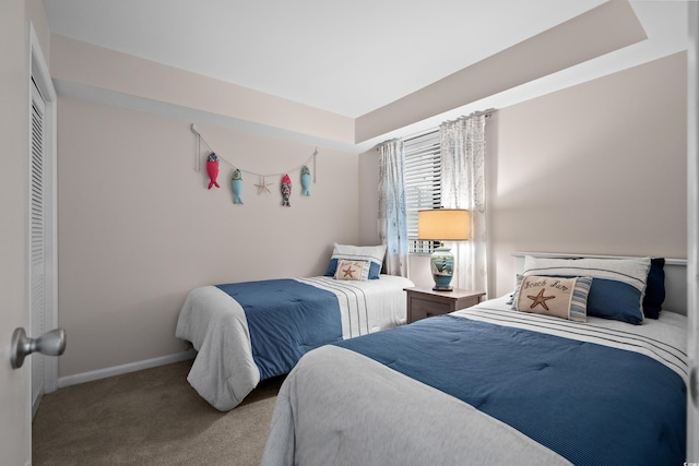 carpeted bedroom with baseboards