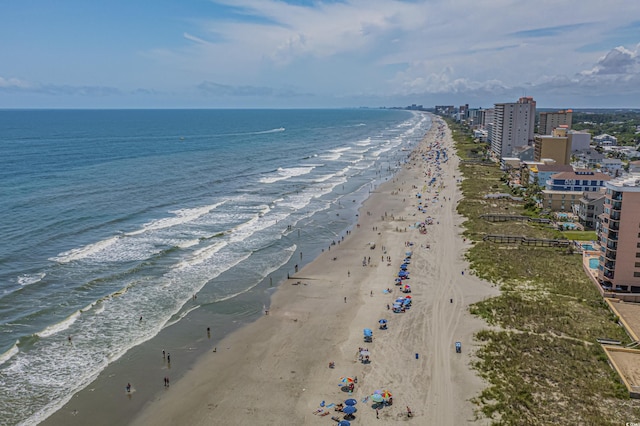 aerial view with a water view and a view of the beach