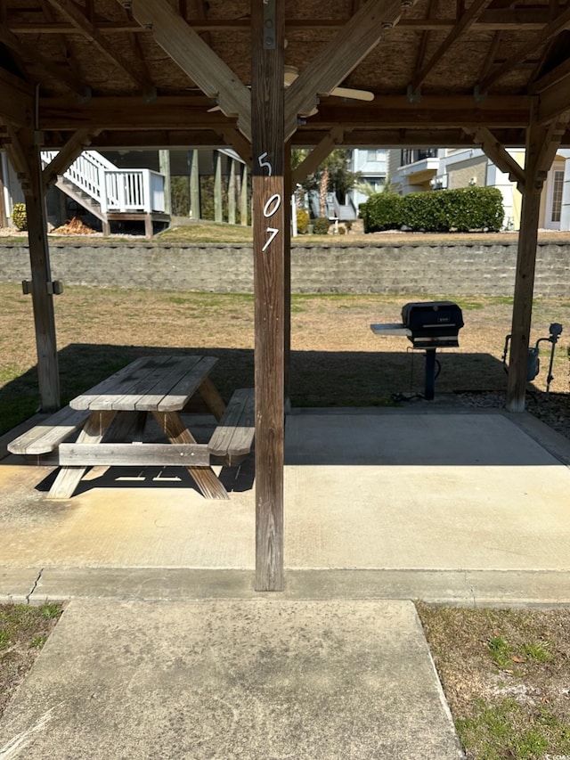 view of property's community with a patio