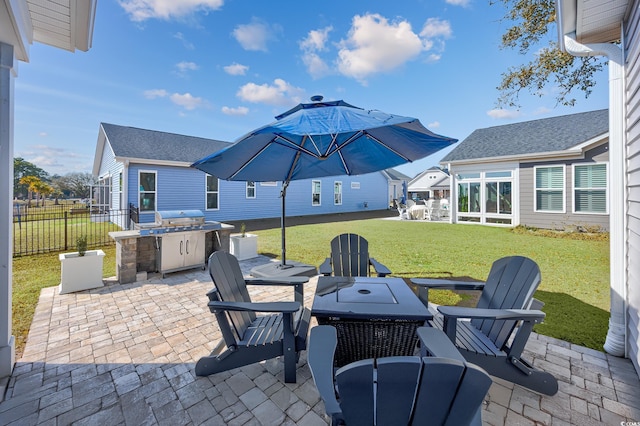 view of patio / terrace with a grill and fence