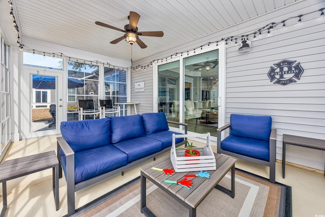 sunroom featuring a ceiling fan