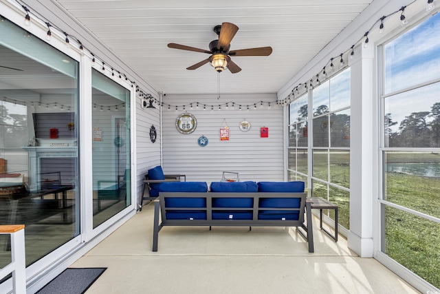 sunroom with a ceiling fan