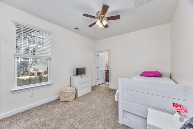 bedroom featuring baseboards, ceiling fan, visible vents, and light colored carpet