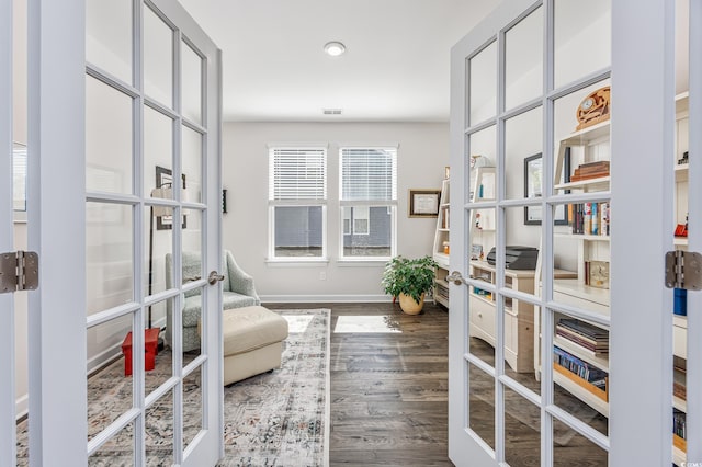 office area with baseboards, wood finished floors, and french doors