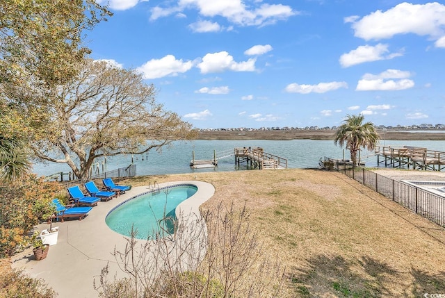 view of swimming pool featuring a fenced in pool, a water view, a boat dock, and fence