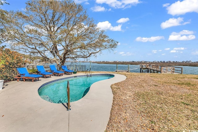 pool featuring a yard and a patio