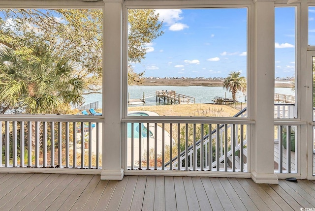 deck with a water view and a boat dock