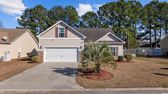 view of front of property featuring board and batten siding, brick siding, driveway, and fence