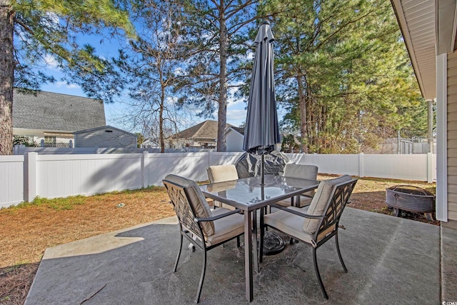 view of patio with a fenced backyard and outdoor dining space